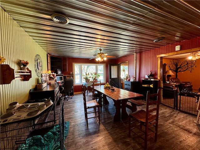 dining room with visible vents, ceiling fan, and wood finished floors