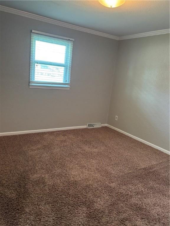 905 W Evergreen Ave, Effingham, IL 62401 - spare room featuring crown molding and carpet