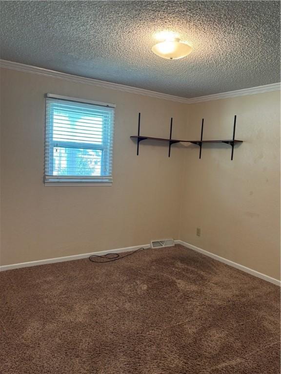905 W Evergreen Ave, Effingham, IL 62401 - spare room featuring a textured ceiling, carpet flooring, and ornamental molding