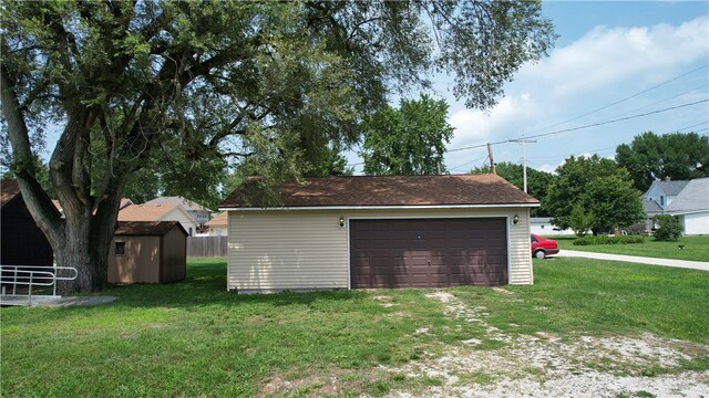 garage with a yard