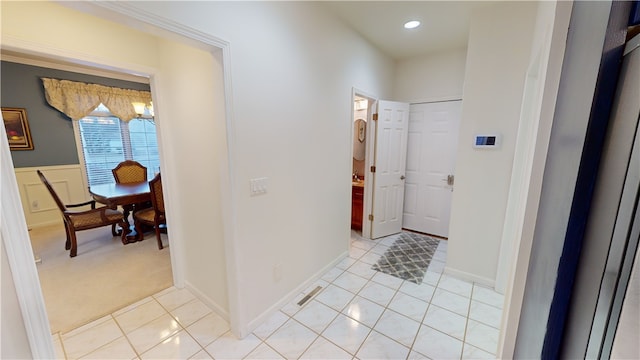 hallway featuring light tile patterned flooring