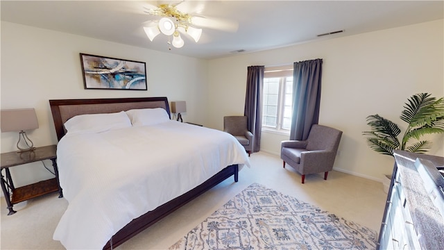 bedroom with light colored carpet and ceiling fan