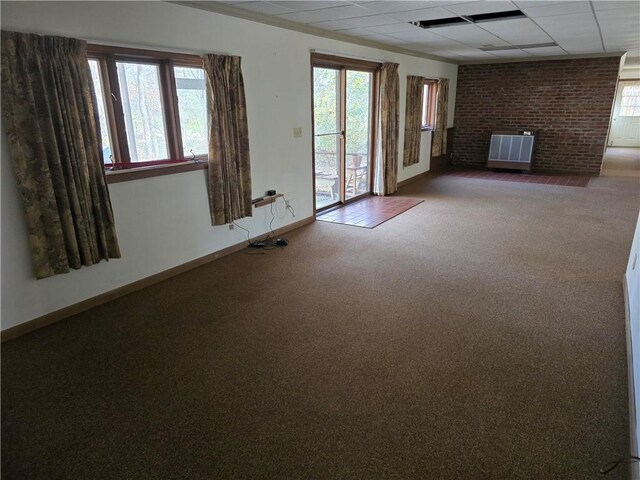 20746 E 400 N, Charleston, IL 61920 - unfurnished living room with carpet, baseboards, and a drop ceiling