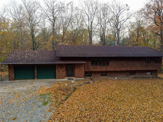 20746 E 400 N, Charleston, IL 61920 - view of front of property featuring brick siding, gravel driveway, and an attached garage