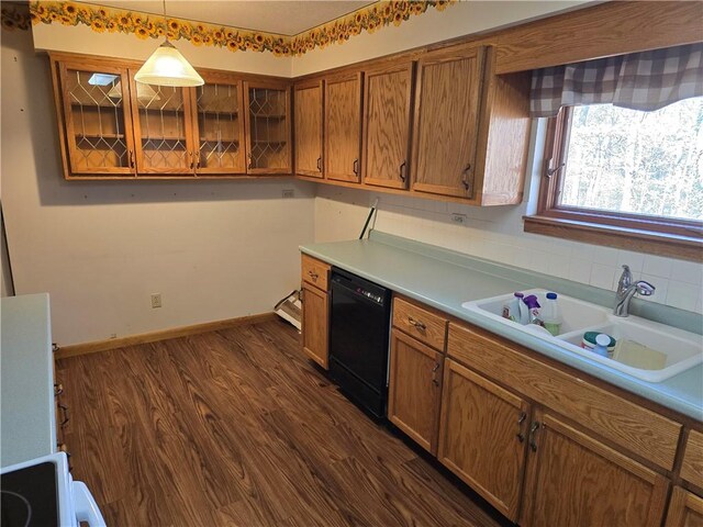 20746 E 400 N, Charleston, IL 61920 - kitchen featuring black dishwasher, brown cabinetry, a sink, glass insert cabinets, and hanging light fixtures
