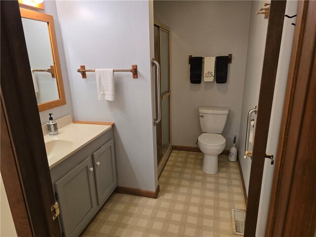 20746 E 400 N, Charleston, IL 61920 - full bath with tile patterned floors, toilet, vanity, a shower stall, and baseboards