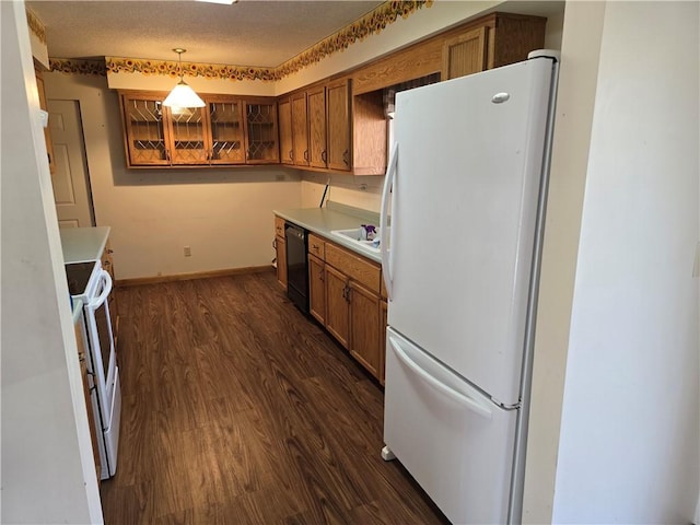 20746 E 400 N, Charleston, IL 61920 - kitchen featuring white appliances, brown cabinets, light countertops, and dark wood-style flooring