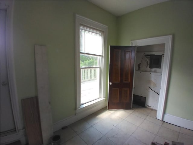 172 Broadway St, Shelbyville, IL 62565 - doorway to outside featuring baseboards and light tile patterned floors