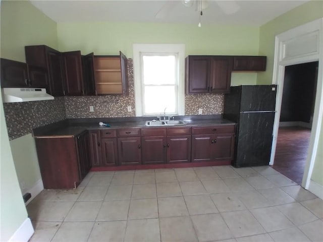 172 Broadway St, Shelbyville, IL 62565 - kitchen with under cabinet range hood, ceiling fan, a sink, and dark countertops