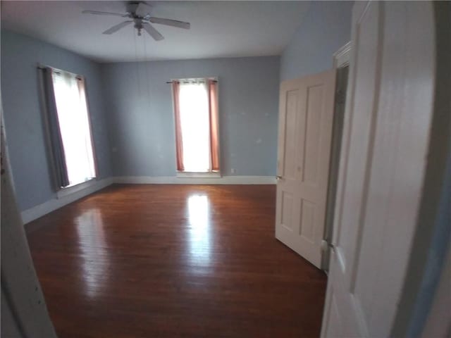 172 Broadway St, Shelbyville, IL 62565 - spare room featuring ceiling fan, baseboards, a healthy amount of sunlight, and wood finished floors