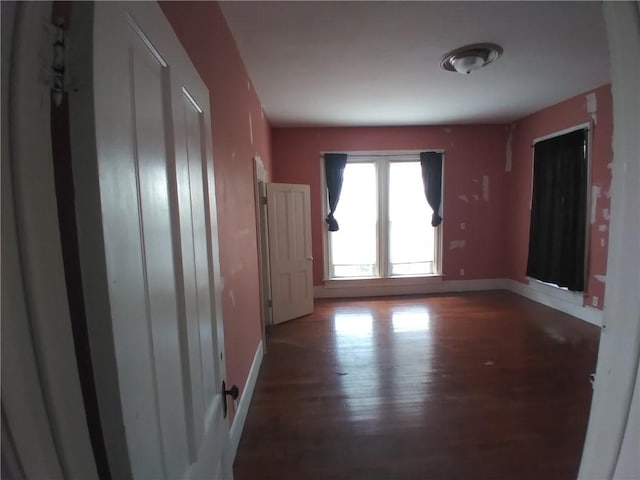172 Broadway St, Shelbyville, IL 62565 - empty room with wood finished floors and baseboards