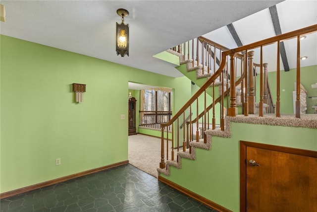 staircase with baseboards