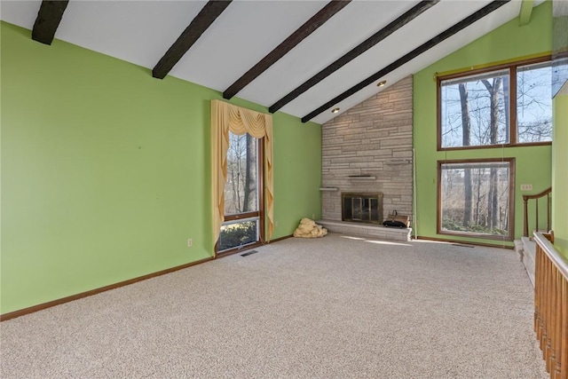 unfurnished living room featuring visible vents, beamed ceiling, high vaulted ceiling, a fireplace, and baseboards