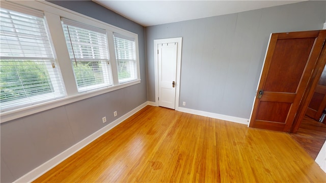 104 E N St, Ridgefarm, IL 61870 - unfurnished room featuring light wood-style floors and baseboards