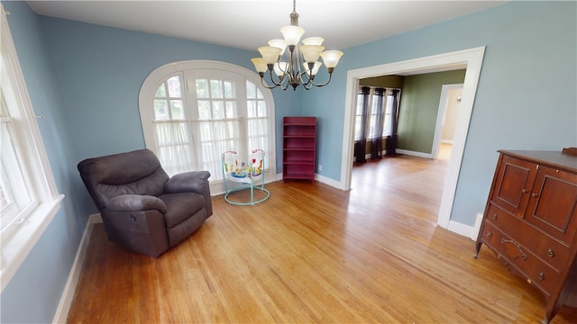 104 E N St, Ridgefarm, IL 61870 - sitting room with light wood-style flooring and a chandelier