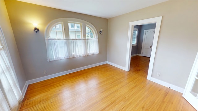 104 E N St, Ridgefarm, IL 61870 - unfurnished room with wood finished floors and baseboards