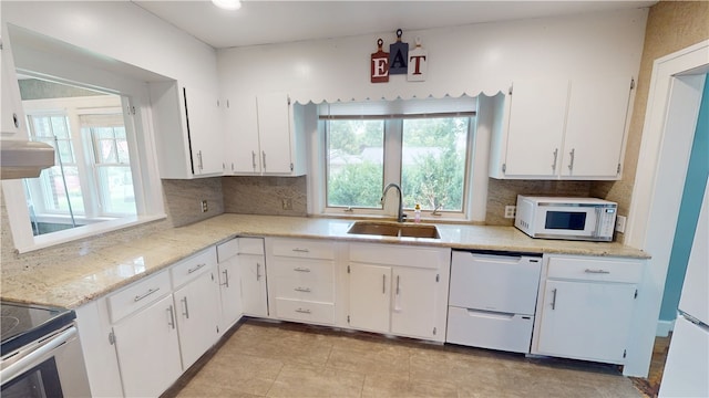 104 E N St, Ridgefarm, IL 61870 - kitchen featuring white appliances, white cabinets, decorative backsplash, and light stone countertops