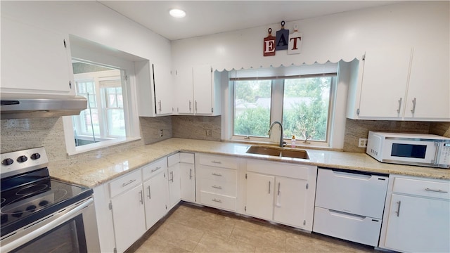 104 E N St, Ridgefarm, IL 61870 - kitchen with white appliances, healthy amount of natural light, white cabinets, and recessed lighting