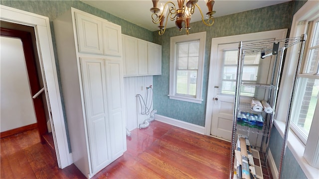 104 E N St, Ridgefarm, IL 61870 - washroom with dark wood-type flooring, wallpapered walls, and a chandelier