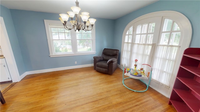 104 E N St, Ridgefarm, IL 61870 - sitting room featuring light wood-style floors and a chandelier