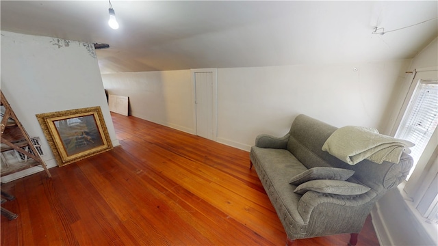 104 E N St, Ridgefarm, IL 61870 - living area featuring vaulted ceiling and hardwood / wood-style floors