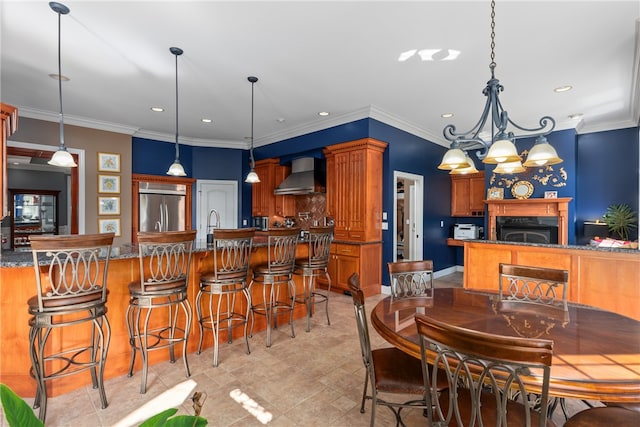 dining area featuring an inviting chandelier and crown molding