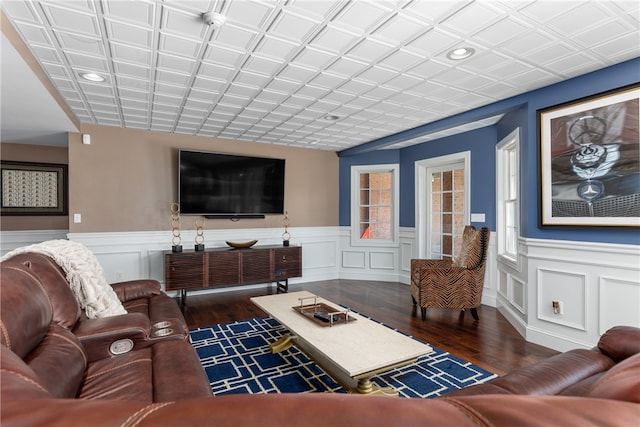 living room with dark hardwood / wood-style flooring