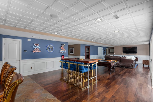 bar featuring dark hardwood / wood-style floors