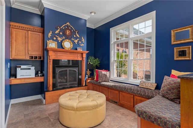 sitting room featuring plenty of natural light and ornamental molding