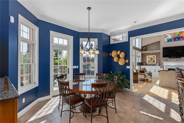 dining room featuring a chandelier and crown molding