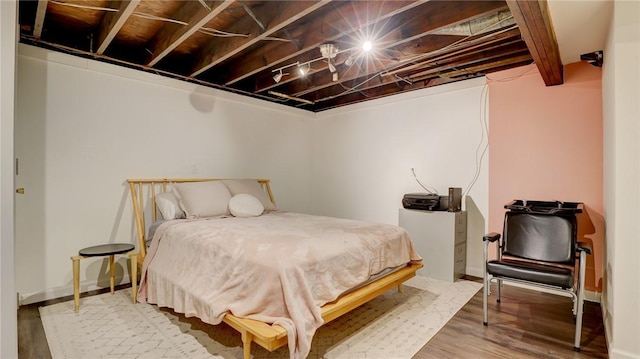 bedroom featuring hardwood / wood-style floors