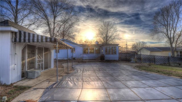 view of patio terrace at dusk