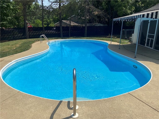 view of swimming pool featuring a patio area