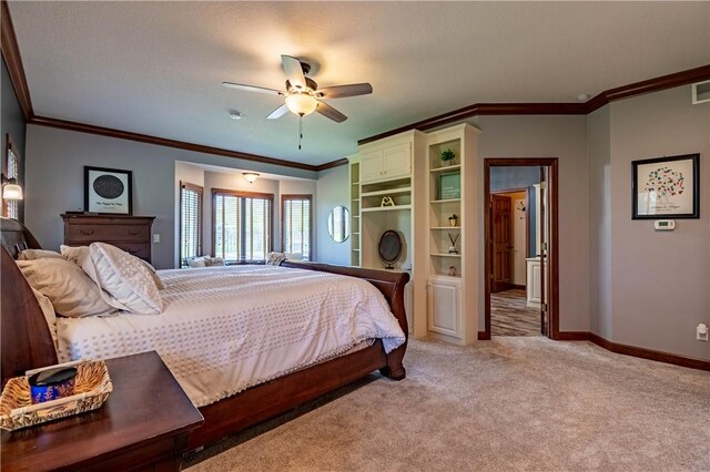 bedroom featuring crown molding, light carpet, and baseboards