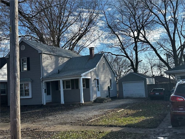 view of front of property featuring an outbuilding and a garage