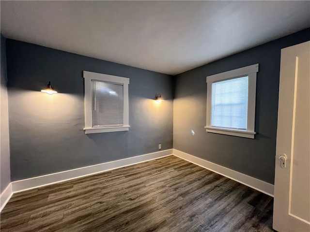 empty room featuring dark hardwood / wood-style floors