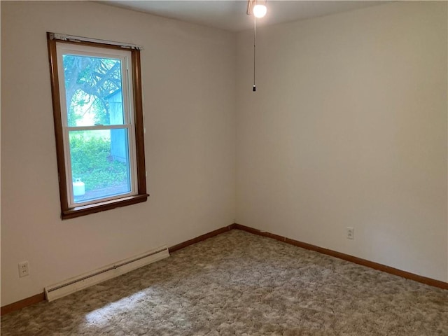 502 Davis St, Newton, IL 62448 - unfurnished room featuring baseboard heating, carpet, and baseboards