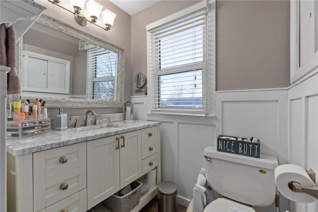 bathroom featuring vanity and toilet