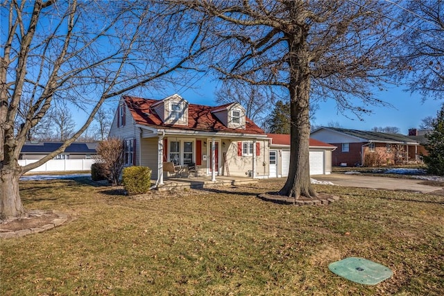 cape cod home with a garage, a front lawn, and covered porch