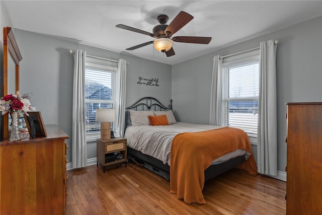 bedroom featuring ceiling fan and light wood-type flooring