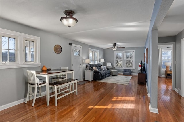 dining area with dark hardwood / wood-style flooring