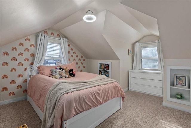 carpeted bedroom featuring lofted ceiling