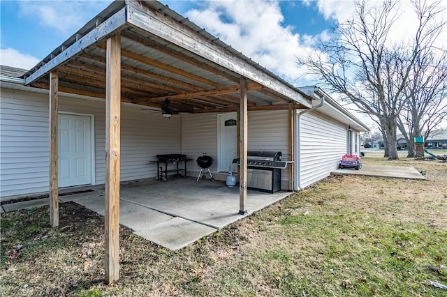 exterior space featuring a grill and ceiling fan