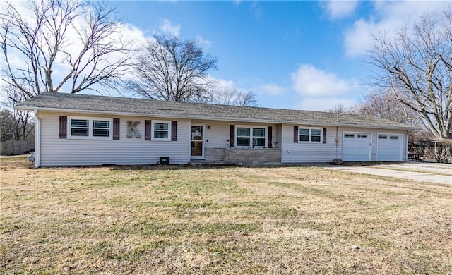 ranch-style home with a garage and a front yard