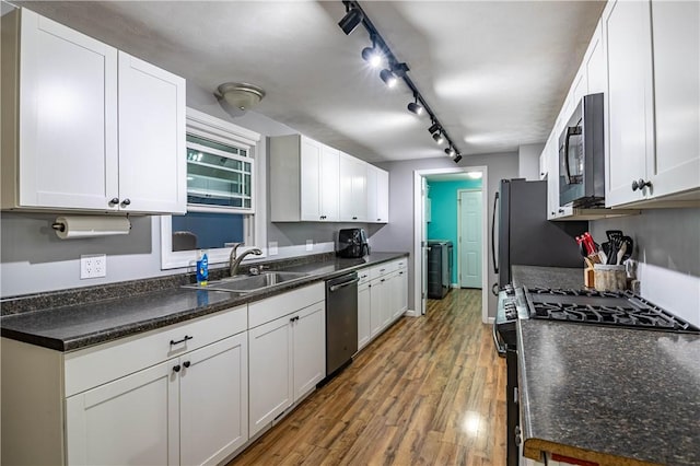 kitchen with white cabinetry, sink, and appliances with stainless steel finishes