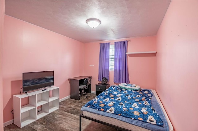 bedroom featuring wood-type flooring