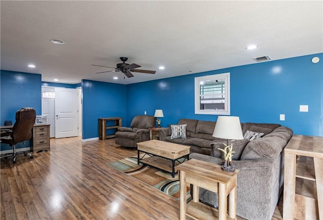 living room with hardwood / wood-style floors and ceiling fan