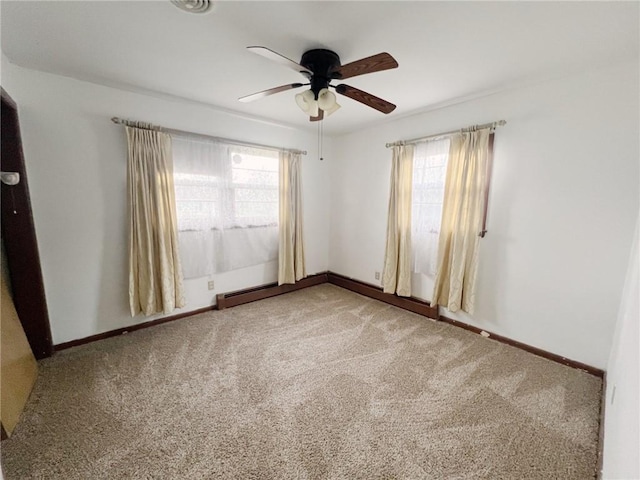 2810 Townway Rd, Danville, IL 61832 - spare room with baseboards, carpet, and a ceiling fan