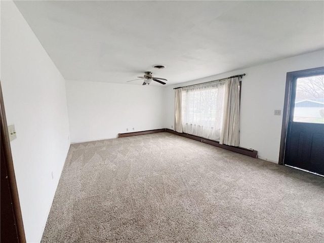 2810 Townway Rd, Danville, IL 61832 - unfurnished room featuring carpet floors, ceiling fan, visible vents, and a healthy amount of sunlight