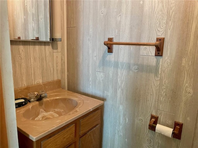 6 S Oakland Rd, Ashmore, IL 61912 - bathroom featuring vanity and wood walls
